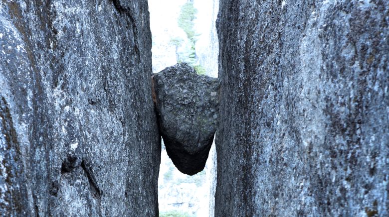 A boulder trapped between two rock faces